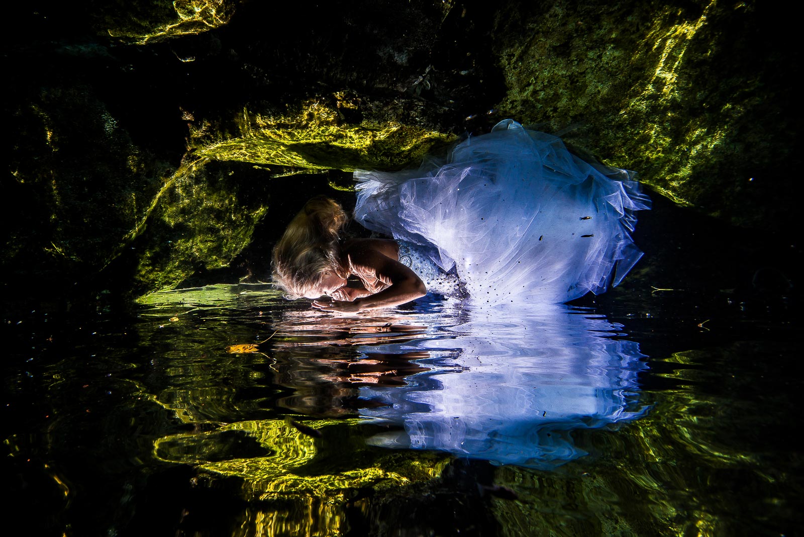 Post wedding underwater photography trash the dress