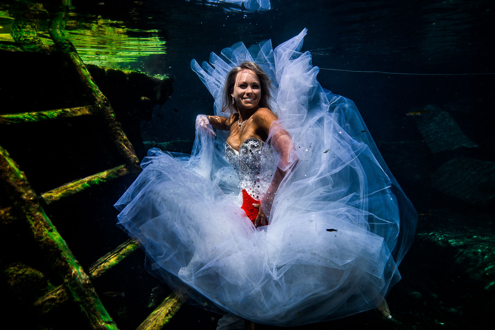 Post wedding underwater photography trash the dress