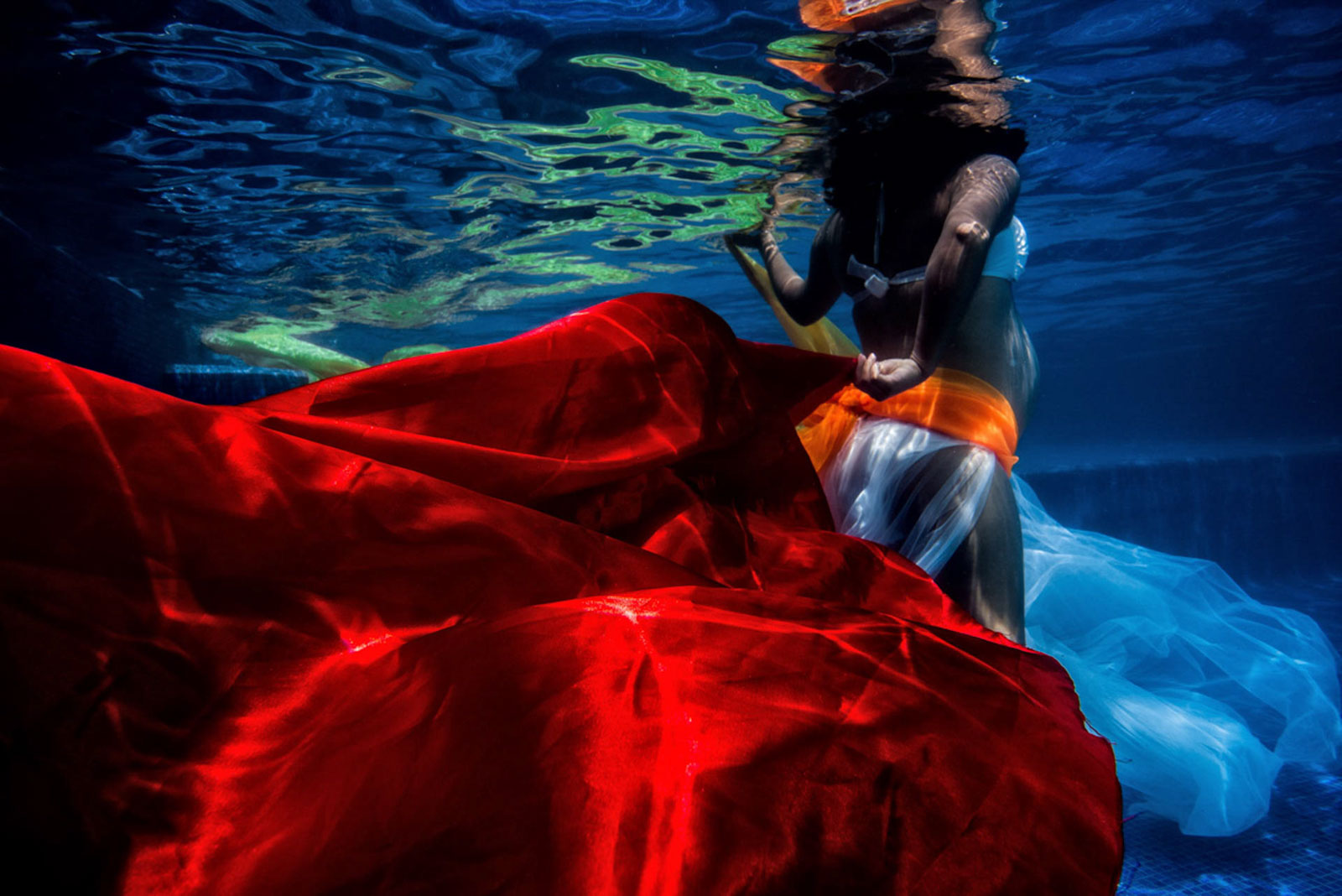 Late pregnancy underwater photos