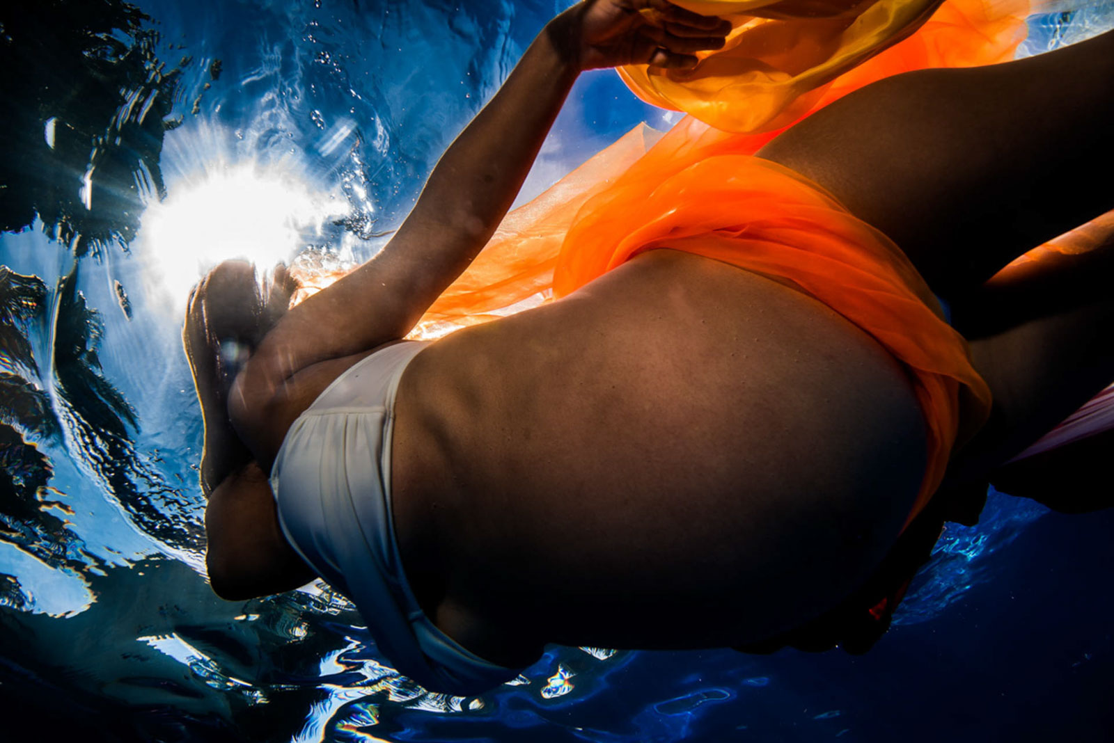 Late pregnancy underwater photos